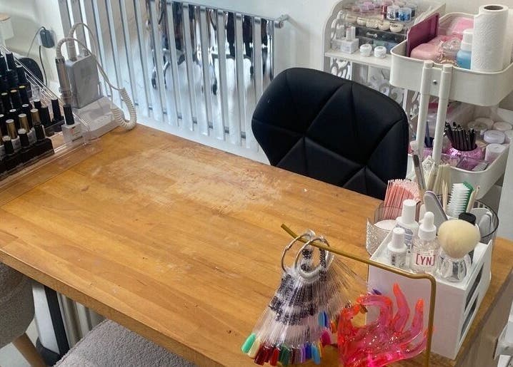Nail station at Claws Out in Warrington, England, GB featuring polishes and manicure tools.