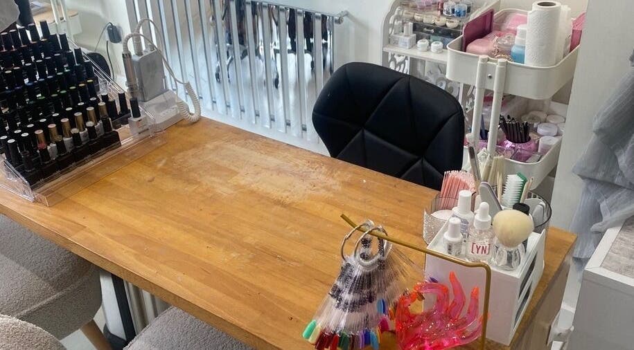 Nail station at Claws Out in Warrington, England, GB featuring polishes and manicure tools.
