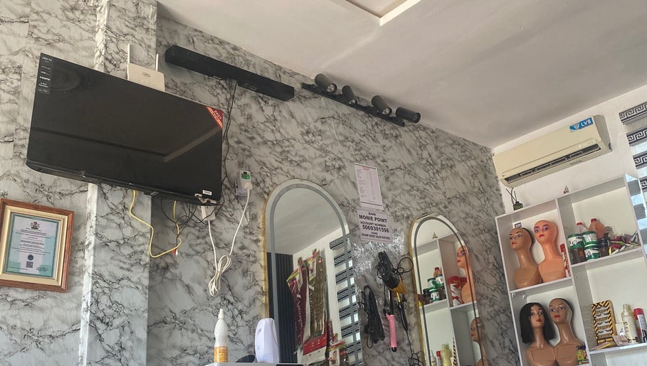Revamp unisex salon interior in Ibadan, Oyo, NG with mirrors and stylish decor.