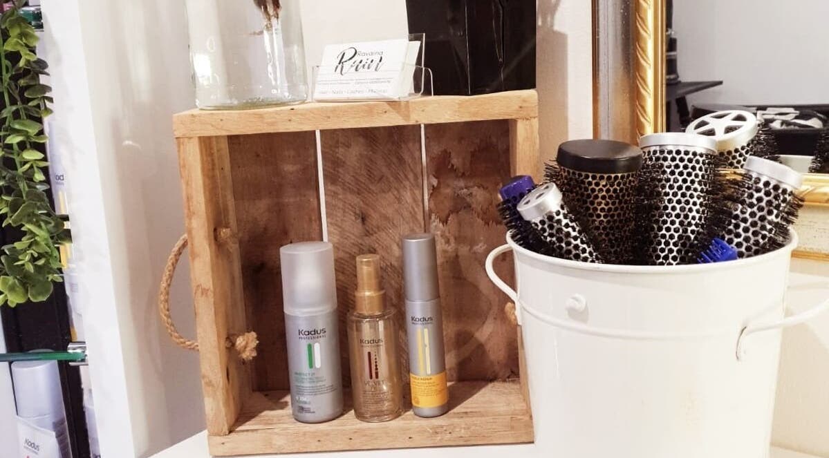 Hair products and brushes at Ravaina Rain Studio, Cape Town, Western Cape, ZA displayed in a wooden and ceramic holder.