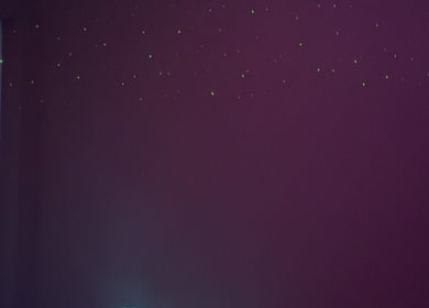 Dimly lit room with starry light effect at Eden’s Retreat, Glenfield, England, GB.