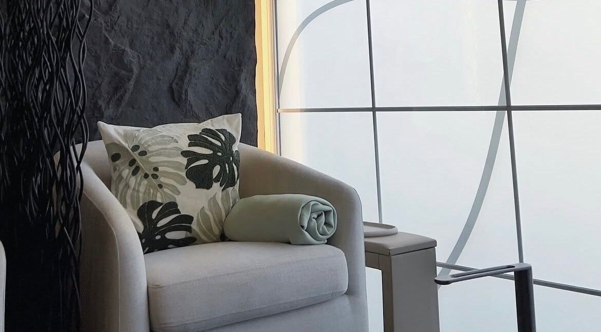 Cozy seating at Hugs Beauty Salon in Muscat, Muscat Governorate, OM with elegant decor and soft lighting.