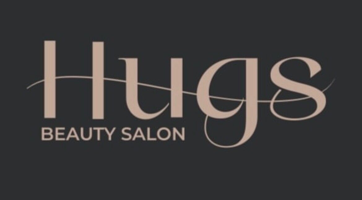 Elegant logo of Hugs Beauty Salon in Muscat, Muscat Governorate, showcasing modern typography.