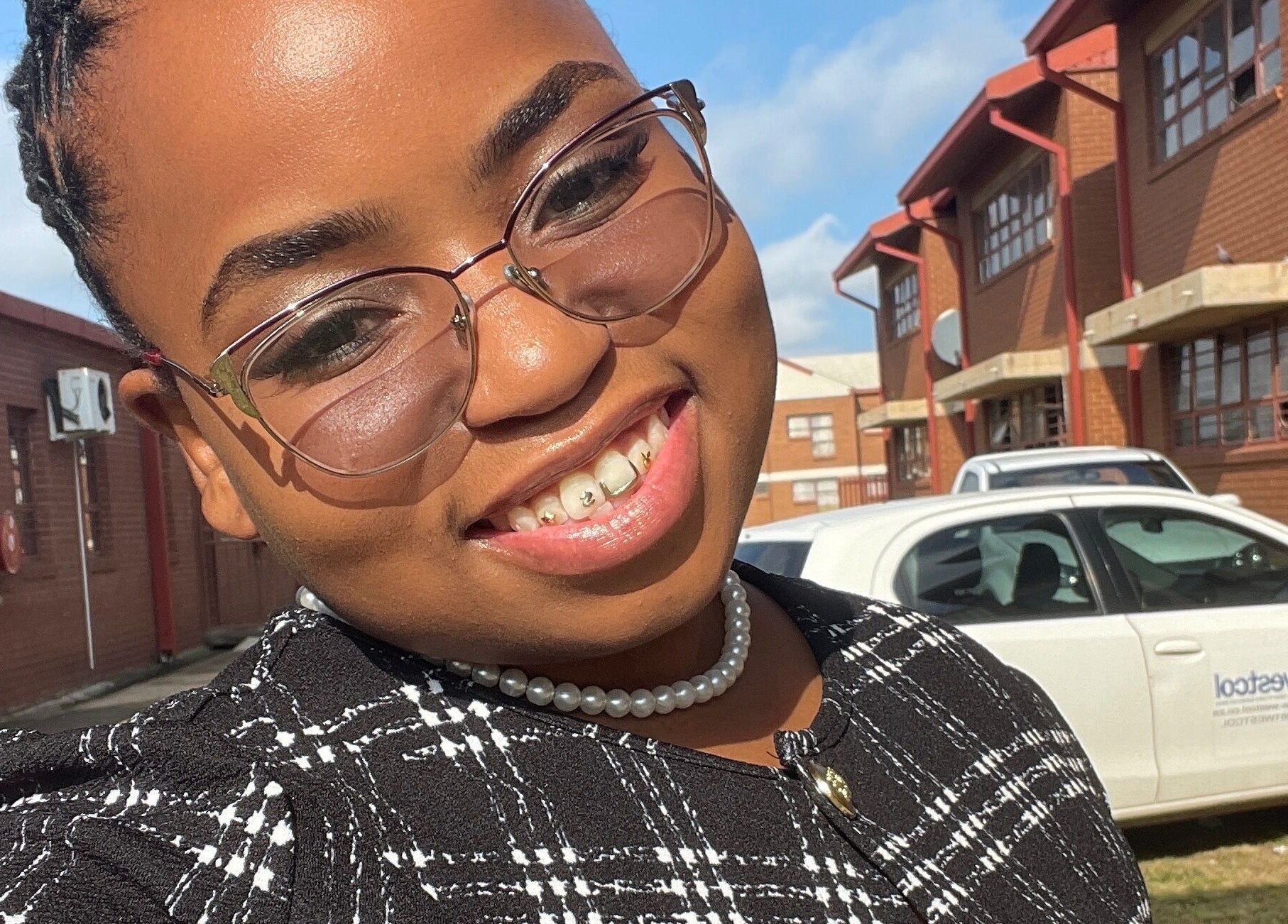 Smiling guest at KgoCgadi’s Beauty and Aesthetics, Carletonville, Gauteng, ZA enjoying a sunny day.
