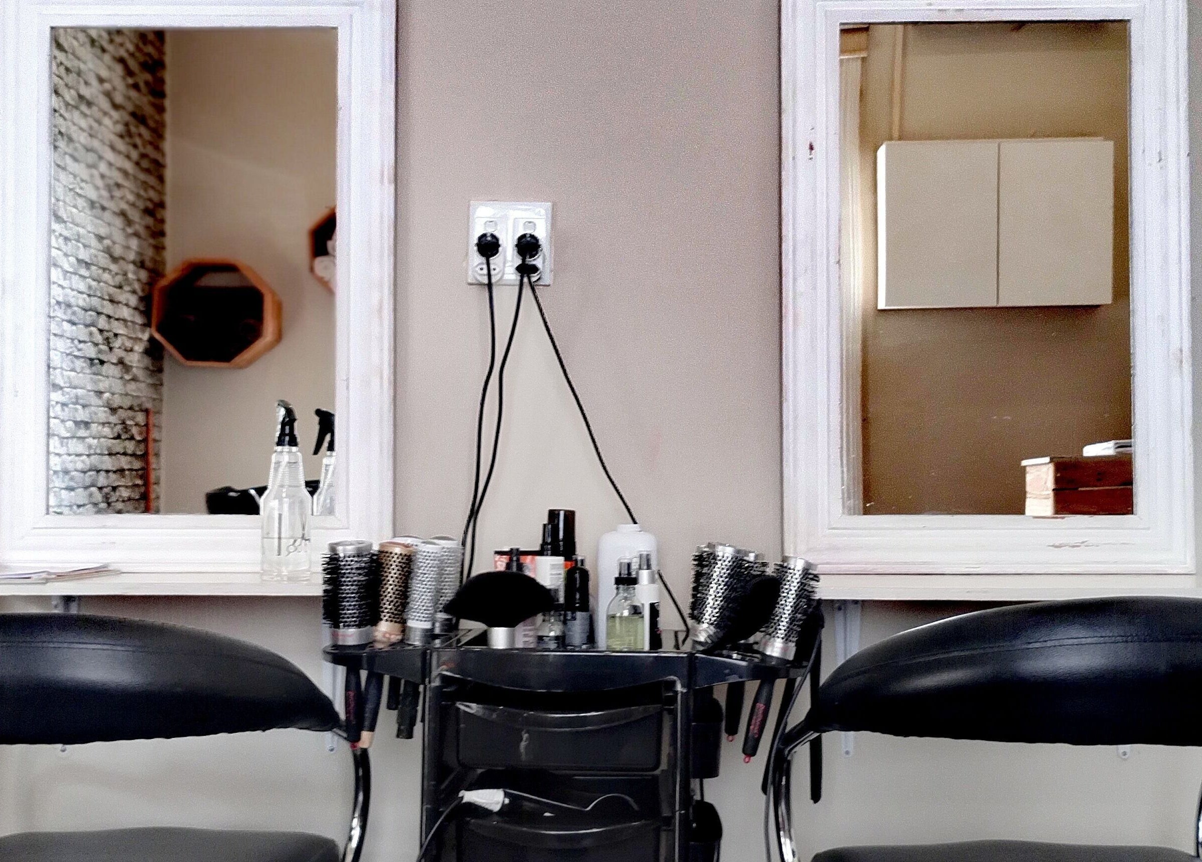 Stylish salon setup at The Stylist Studio, Berea, Kwazulu-natal, ZA featuring mirrors and styling chairs.