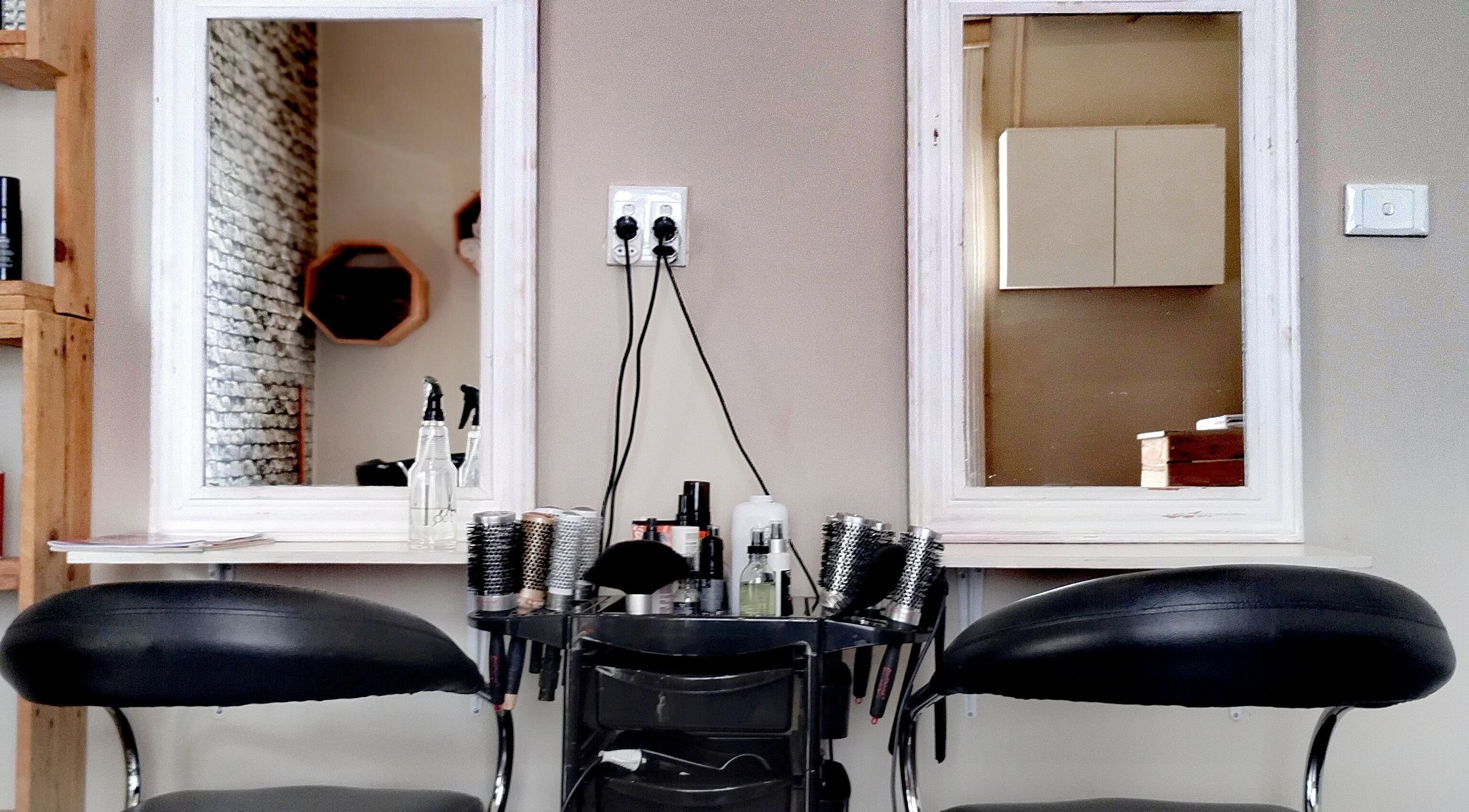 Stylish salon setup at The Stylist Studio, Berea, Kwazulu-natal, ZA featuring mirrors and styling chairs.