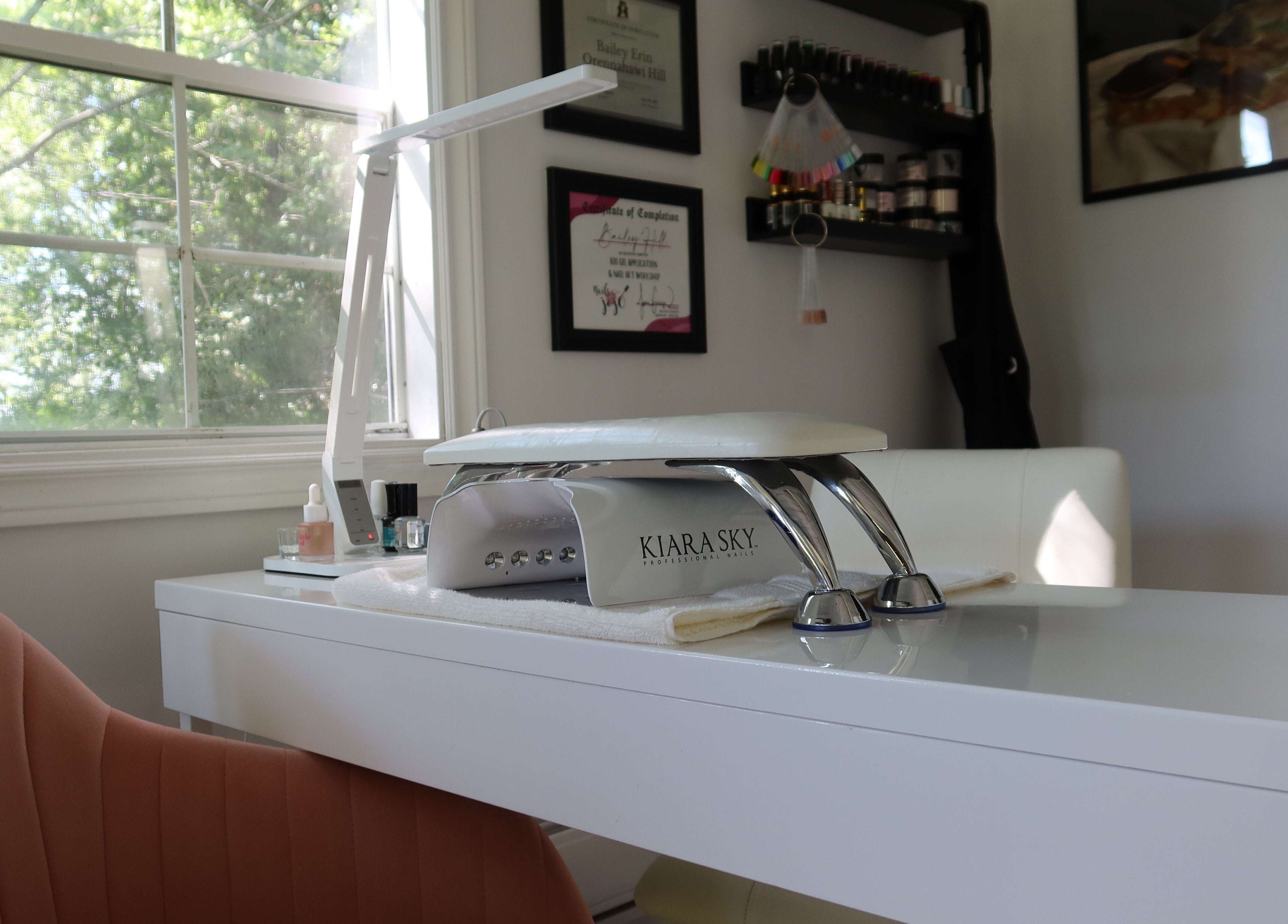 Modern nail station at Yorá:se Nails & Beauty, Brant, Ontario, CA with window view and manicure tools.