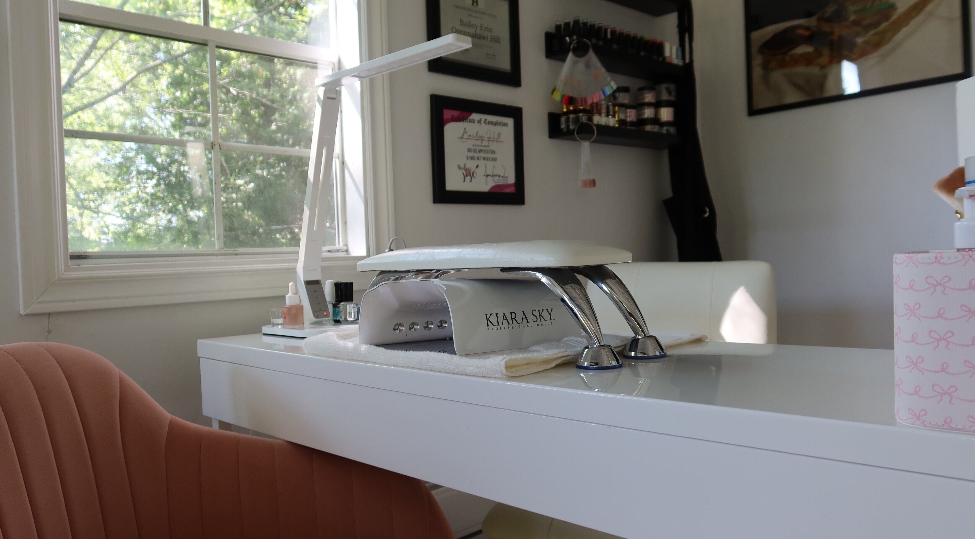 Modern nail station at Yorá:se Nails & Beauty, Brant, Ontario, CA with window view and manicure tools.