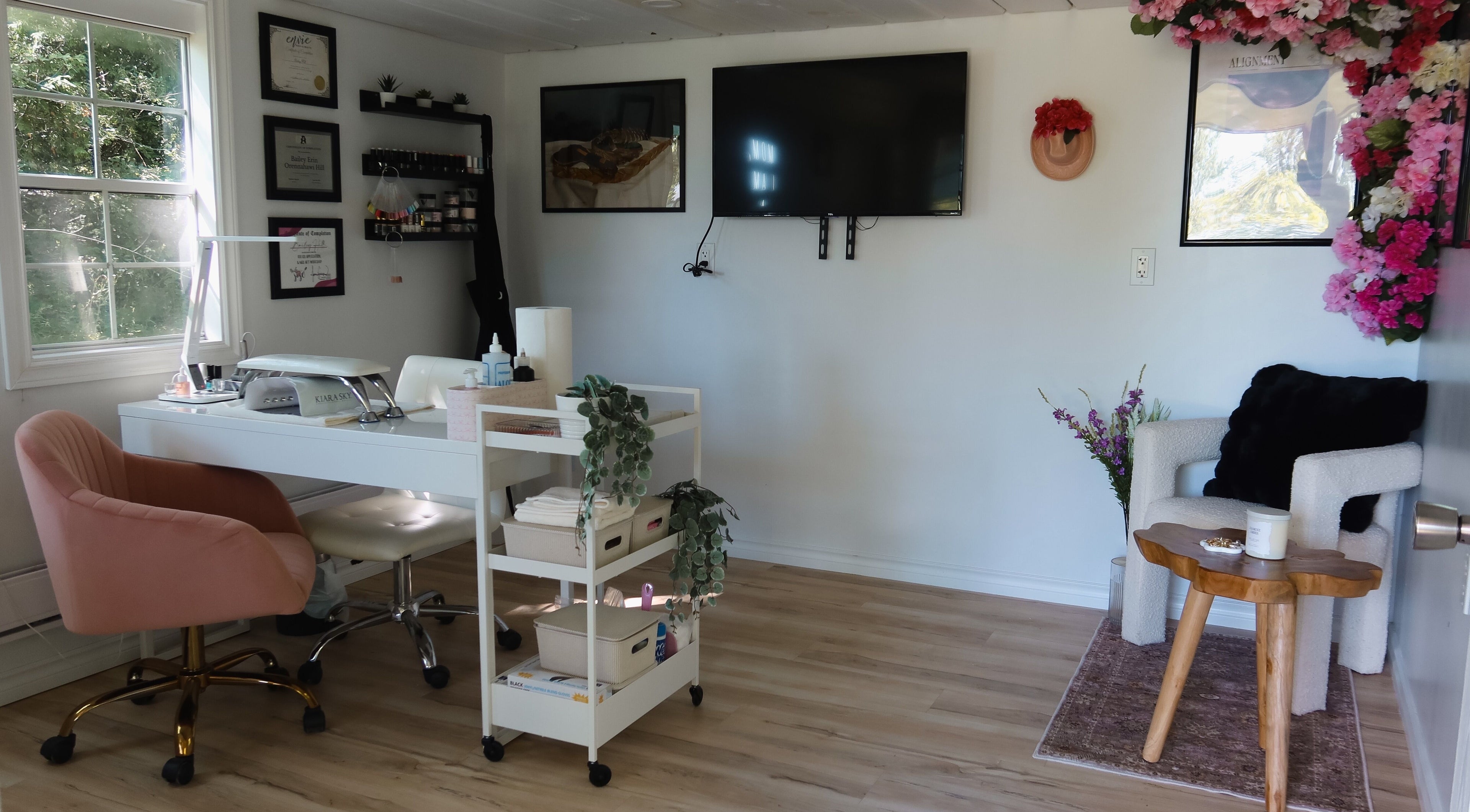 Chic interior of Yorá:se Nails & Beauty in Brant, Ontario, CA featuring cozy seating and stylish decor.