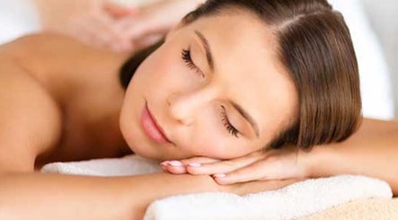 Woman enjoying a relaxing massage at Nudsara Massage, Lyndhurst, England, GB.