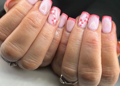 Elegant pink manicure with delicate floral art at Nails & Brows by Donna, Newcastle, Northern Ireland, GB.