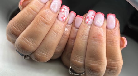 Elegant pink manicure with delicate floral art at Nails & Brows by Donna, Newcastle, Northern Ireland, GB.