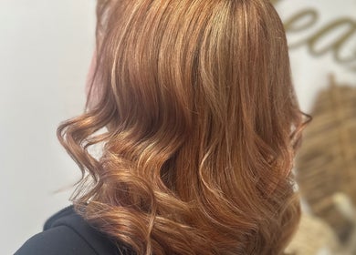 Elegant red curls styled at Morgan Jane Hair, Farnworth, England, GB.