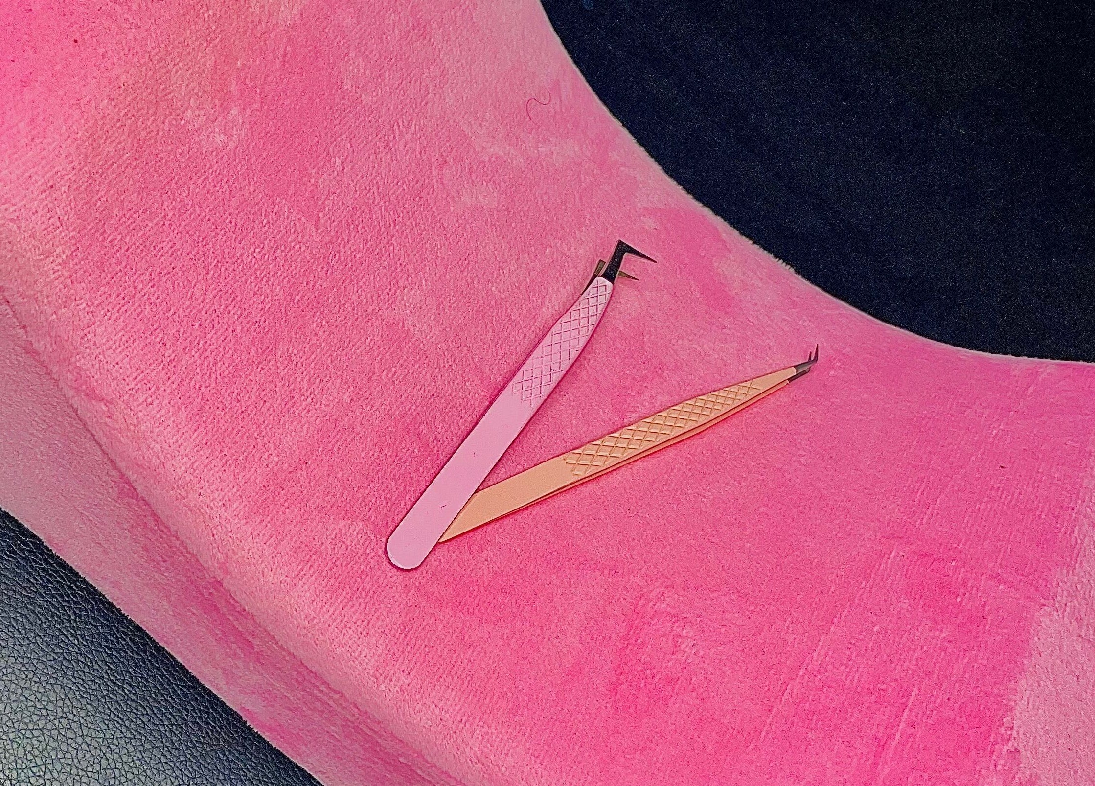 Eyelash tweezers on pink cushion at Dee's Beauty Studio21, Pretoria, Gauteng, ZA.
