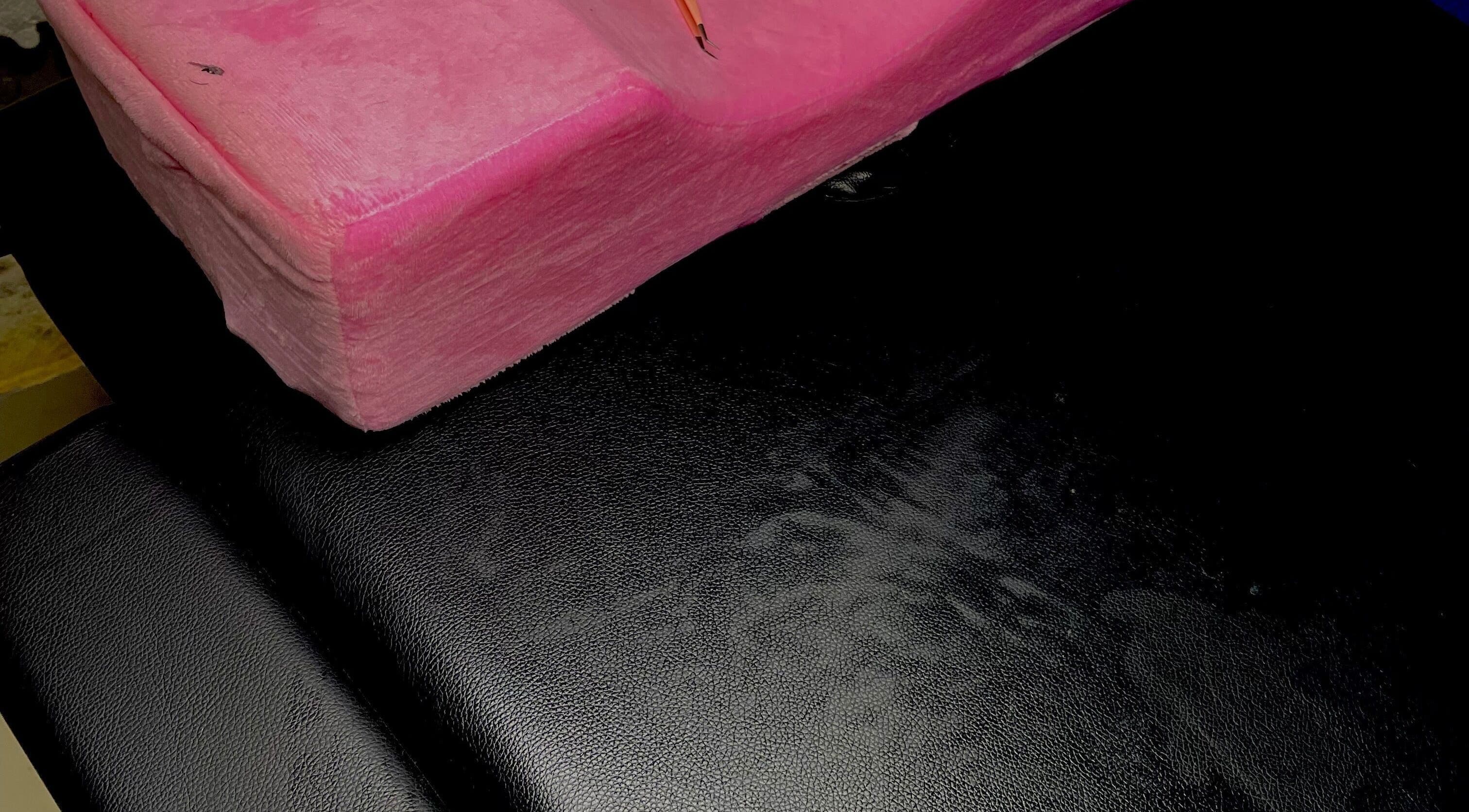 Pink plush cushion on a black chair at Dee's Beauty Studio21, Pretoria, Gauteng, ZA.