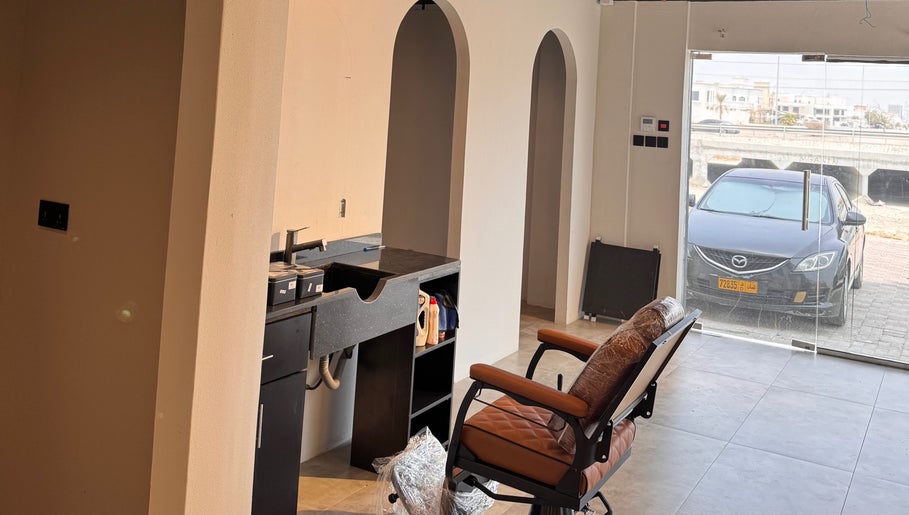 Modern salon setup at Mr Boombastic, Sib, Muscat Governorate, OM with stylish chair and workspace.