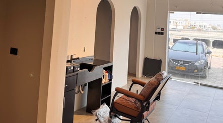 Modern salon setup at Mr Boombastic, Sib, Muscat Governorate, OM with stylish chair and workspace.