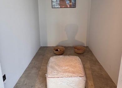Minimalistic relaxation corner at Mr Boombastic, Sib, Muscat Governorate, OM, featuring seating and baskets.