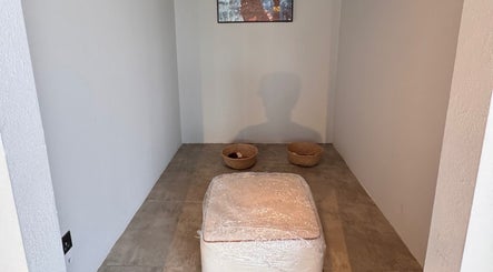 Minimalistic relaxation corner at Mr Boombastic, Sib, Muscat Governorate, OM, featuring seating and baskets.