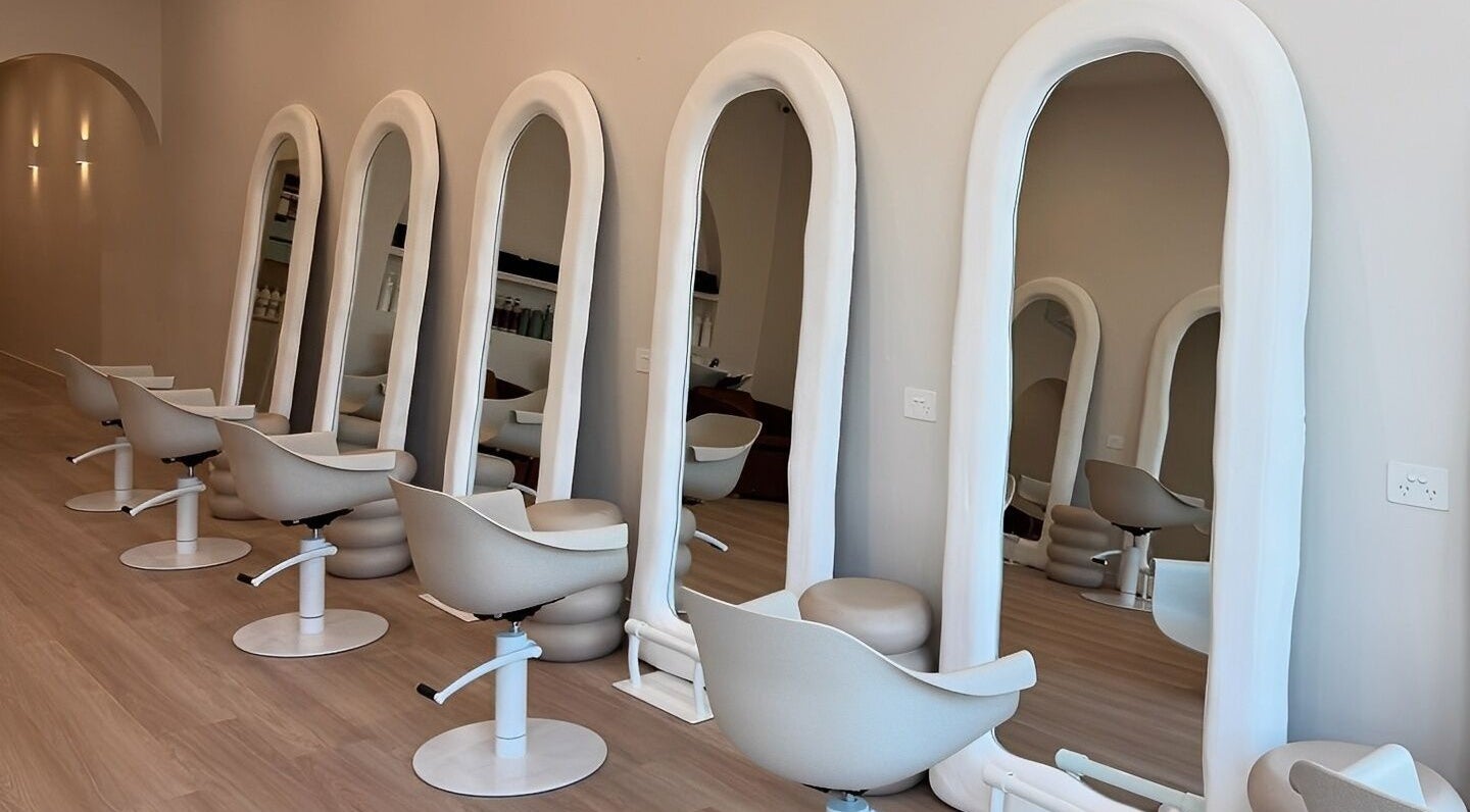 Stylish salon chairs and mirrors at Hair Artistry By Catalina in Mentone, Victoria, AU, offering elegant hair services.