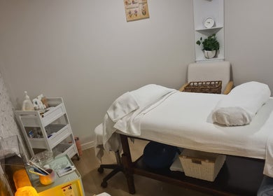 Cozy treatment room at Rare Earth Beauty in Kingscliff, New South Wales, AU with a massage table and spa essentials.