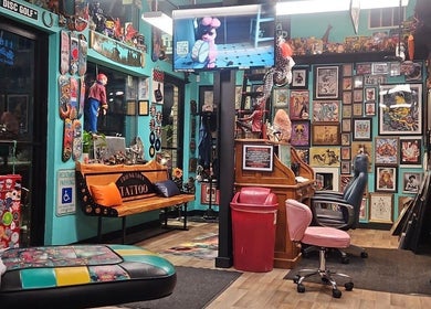 Inside Tony’s Tried & True Tattoo in Port Orchard, Washington, US, showcasing vibrant artwork and seating.