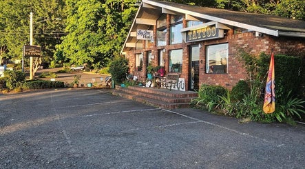 Brick exterior of Tony’s Tried & True Tattoo in Port Orchard, Washington, with welcoming outdoor decor.