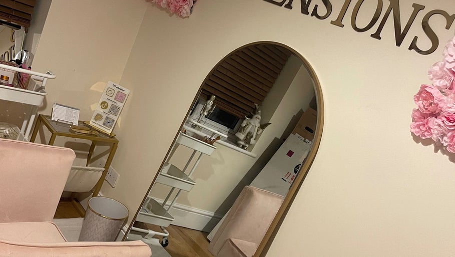 Luxury interior of DBextensions beauty salon, Waltham Cross, England, GB featuring chic decor and large mirror.