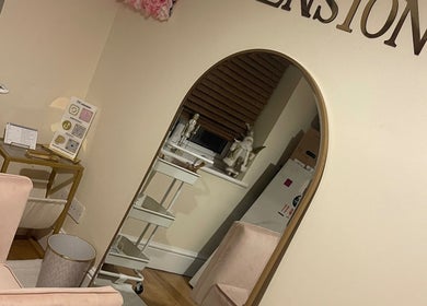 Luxury interior of DBextensions beauty salon, Waltham Cross, England, GB featuring chic decor and large mirror.