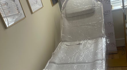 Treatment bed in Pearl Elegance, Waltham Cross, England, GB, showcasing serene atmosphere for beauty sessions.