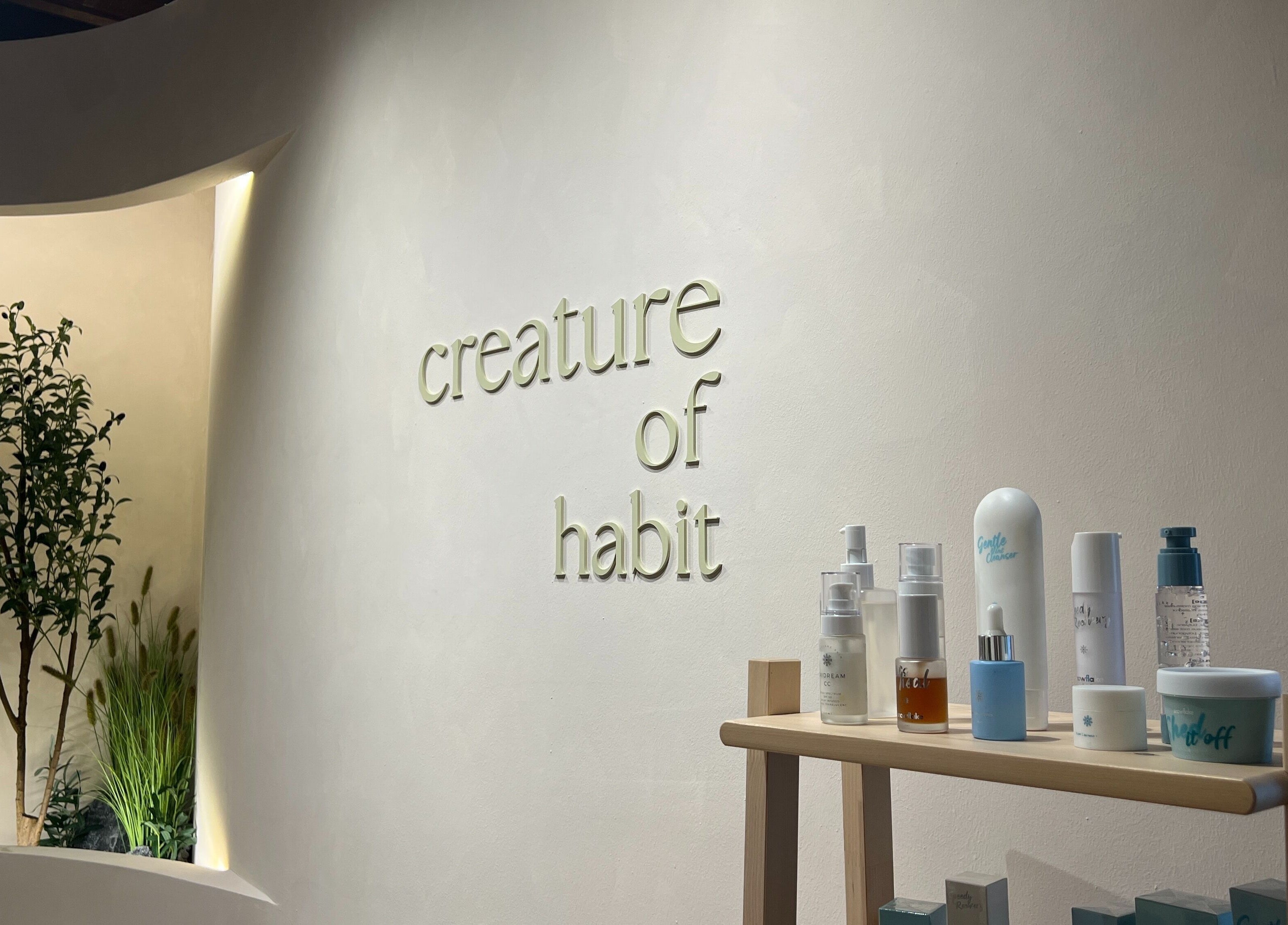 Creature Of Habit Singapore SG features minimalist design with natural elements and skincare products.