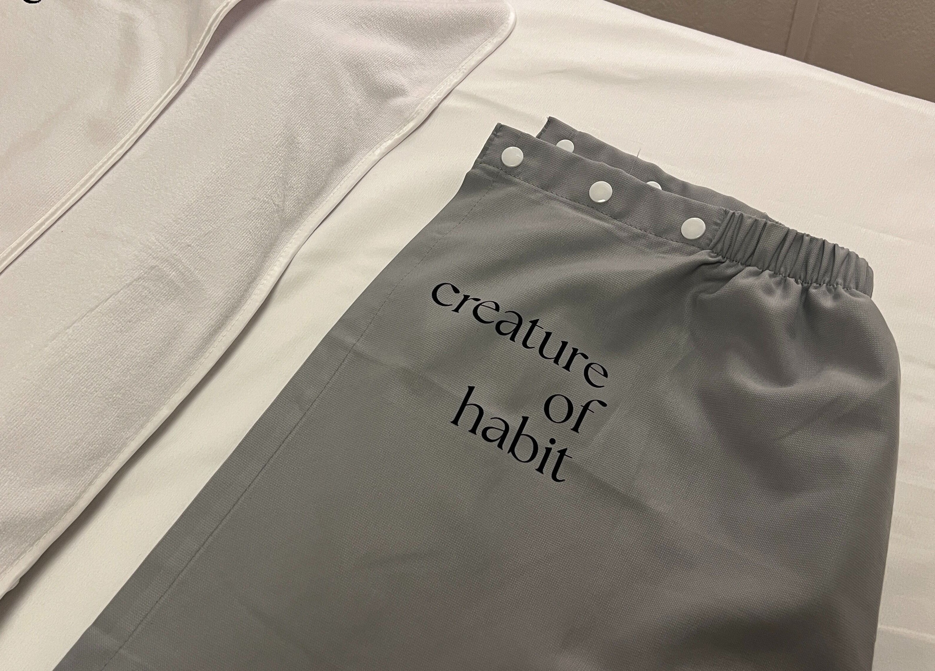 Soft linens and branded cover at Creature Of Habit, Singapore, Singapore, SG.