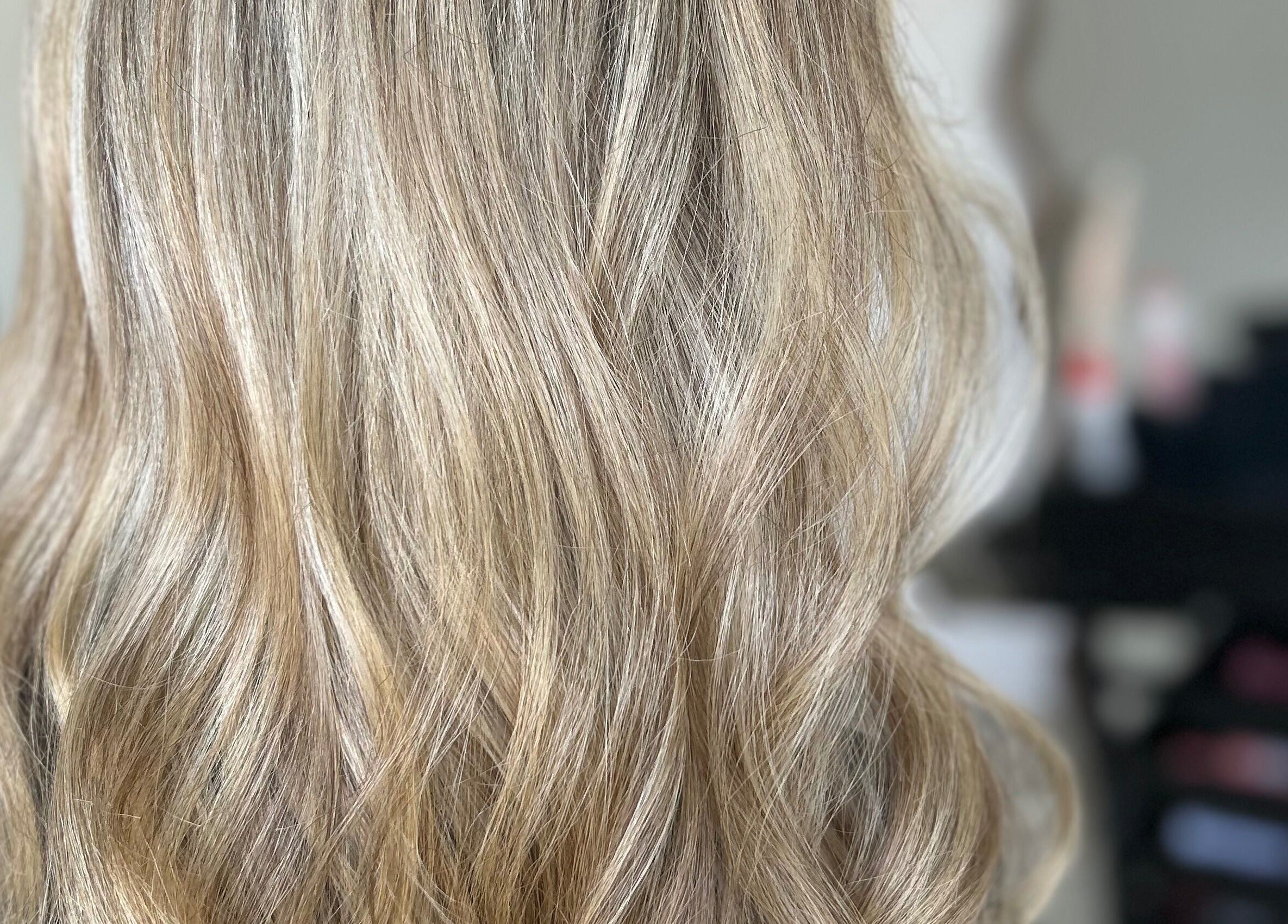 Blonde wavy hair styled at Glossed by Olivia in Northampton, England, GB.