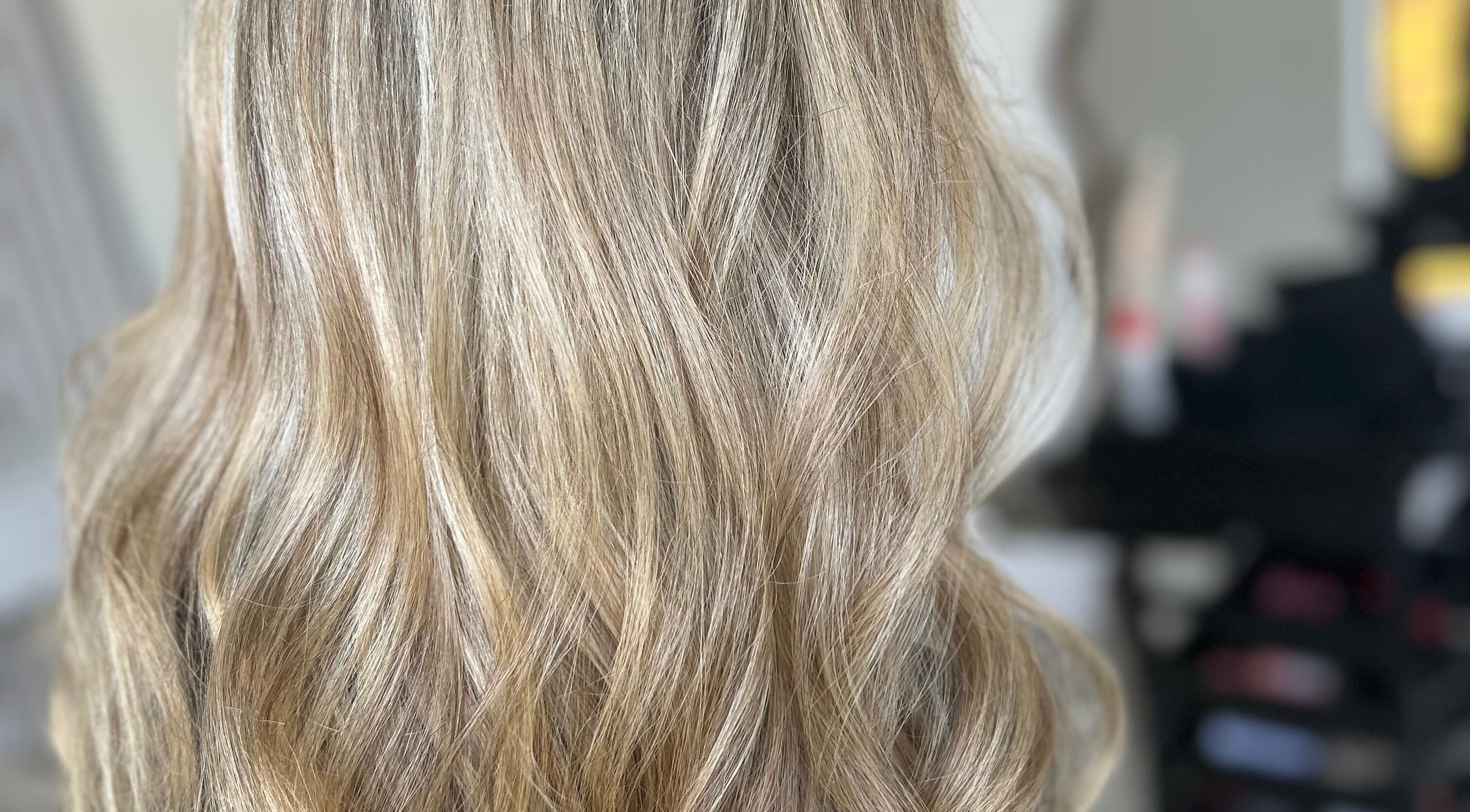 Blonde wavy hair styled at Glossed by Olivia in Northampton, England, GB.