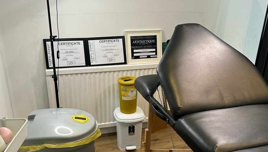 Treatment room at Ara Aesthetics (Home Services Available), Edgware, England, GB showcasing certificates and equipment.