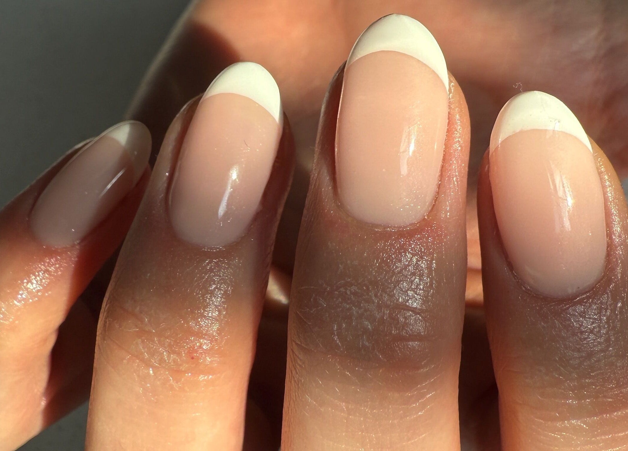 Elegant French manicure at bymiaxglover, Lowestoft, England, GB. Chic nail design with natural finish.