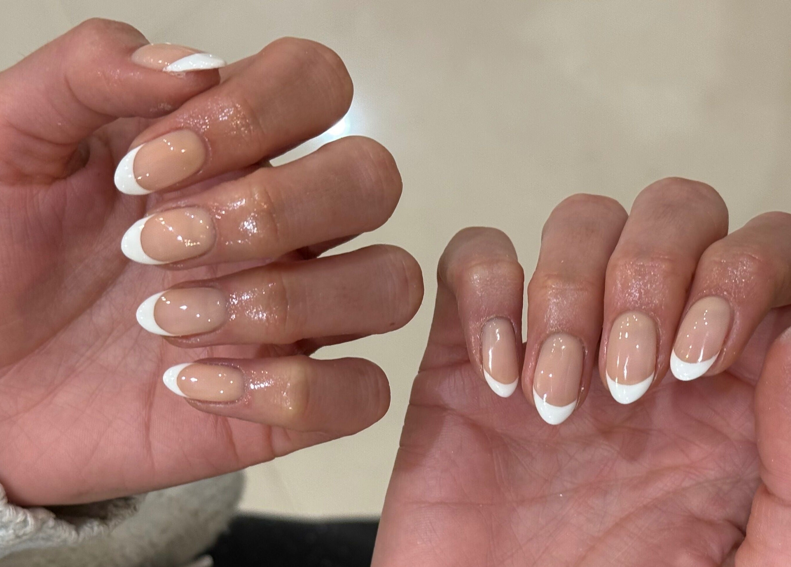Beautiful French manicure at bymiaxglover, Lowestoft, England, GB showcasing glossy, well-groomed nails.