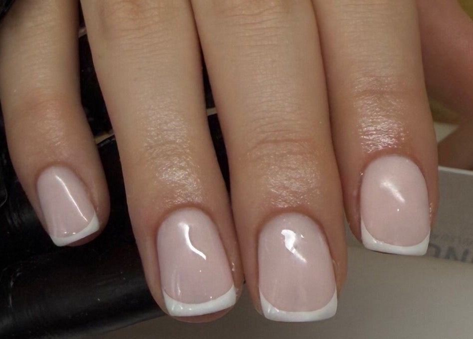 Elegant French manicure at bymiaxglover, Lowestoft, England, GB, showcasing polished nails.