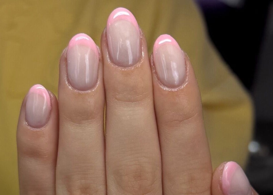 Elegant pink French manicure at bymiaxglover in Lowestoft, England, GB showcasing expert nail art.