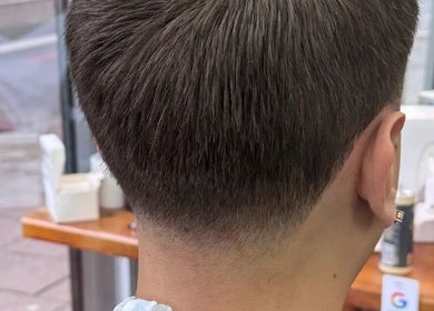 Close-up of a stylish tapered haircut at Sw9 barbers, London, England, GB, showcasing expert grooming.