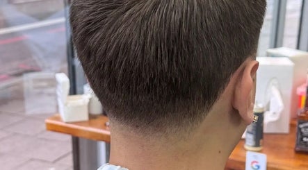 Close-up of a stylish tapered haircut at Sw9 barbers, London, England, GB, showcasing expert grooming.