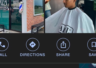 Front of One2k.Barber in Kepala Batas, Kedah, MY with modern barber pole and brick wall.