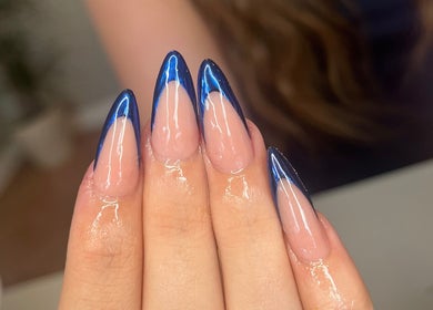 Close-up of glossy nails with blue tips at nailsbyreb_ in Bishopbriggs, Scotland, GB.