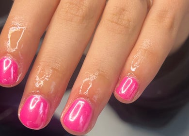 Close-up of vibrant pink manicured nails at nailsbyreb_ in Bishopbriggs, Scotland, GB.