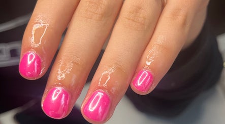 Close-up of vibrant pink manicured nails at nailsbyreb_ in Bishopbriggs, Scotland, GB.