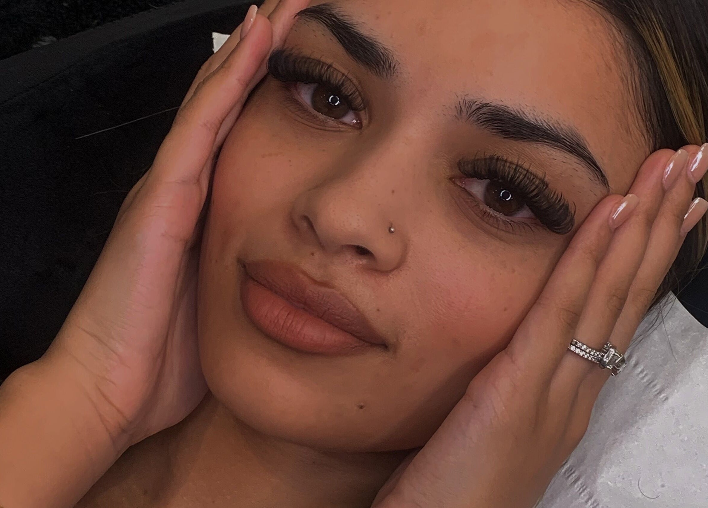 Close-up of a client's face with lush lashes at beauty by imy, Portsmouth, England, GB.