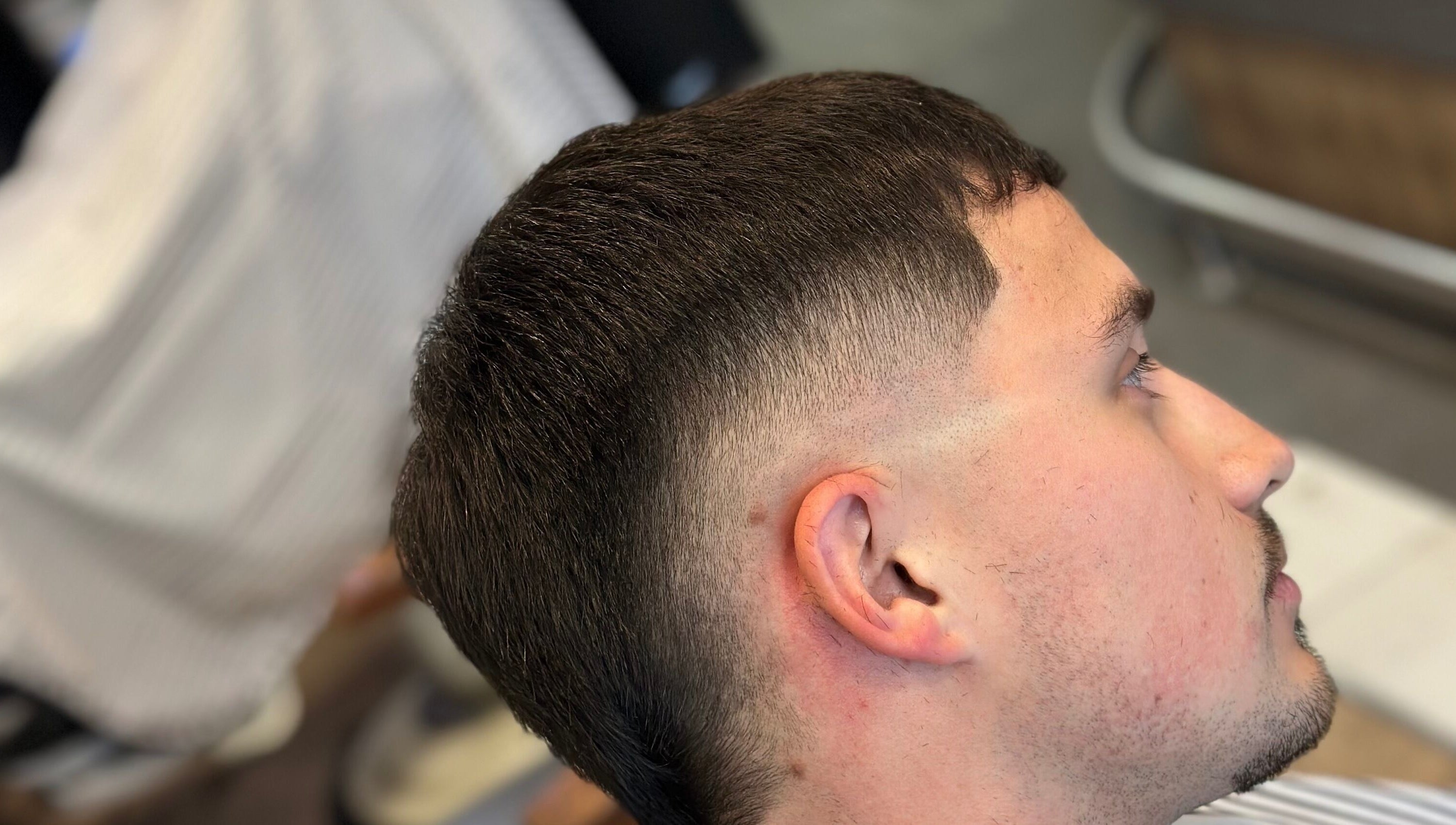 A crisp fade haircut at Nando 23 Cuts, Swords, County Dublin, IE, showcasing precision styling.