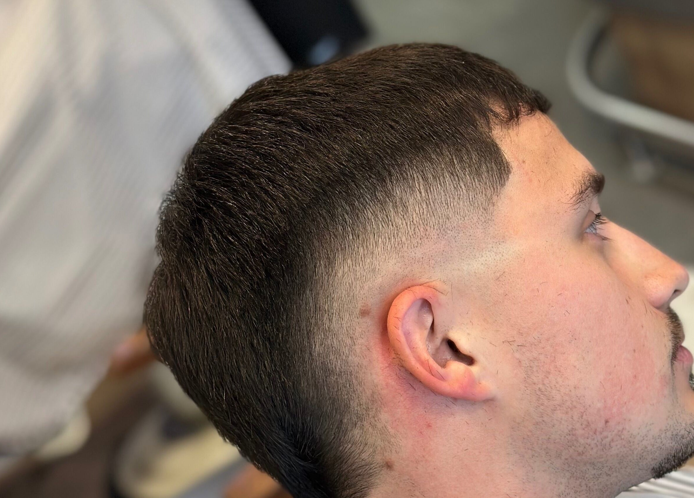 A crisp fade haircut at Nando 23 Cuts, Swords, County Dublin, IE, showcasing precision styling.