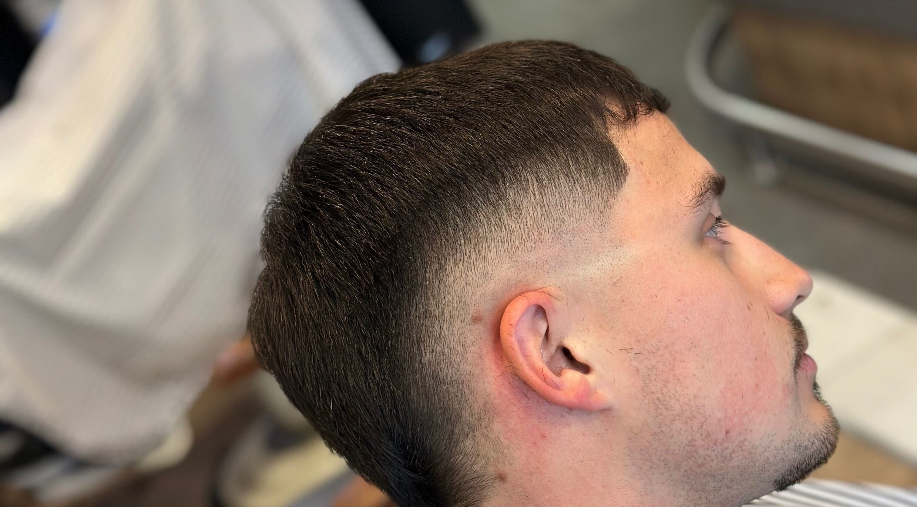 A crisp fade haircut at Nando 23 Cuts, Swords, County Dublin, IE, showcasing precision styling.