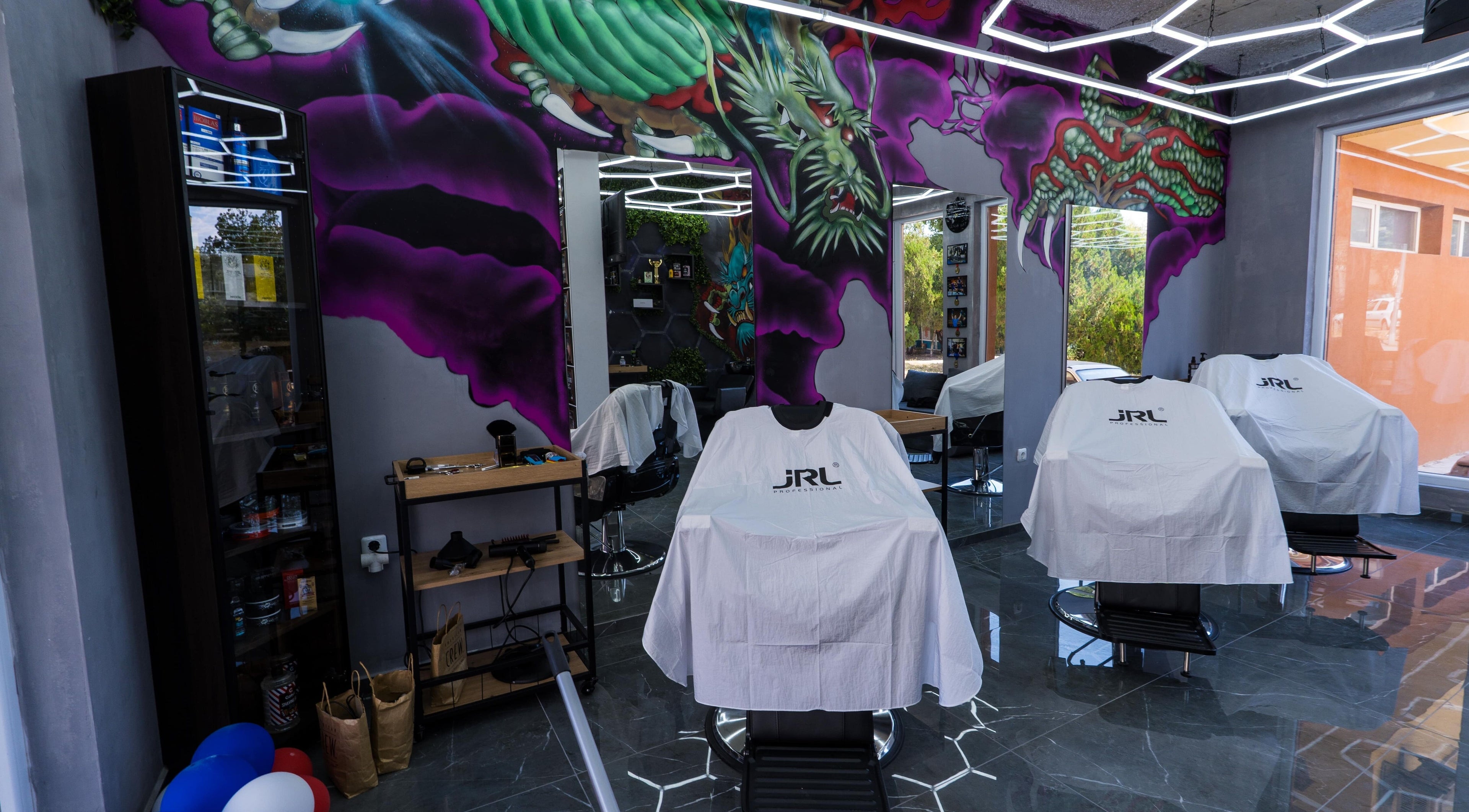 Colorful interior of The Borzz Barbershop in Varna, Varna, BG featuring modern decor and barber chairs.